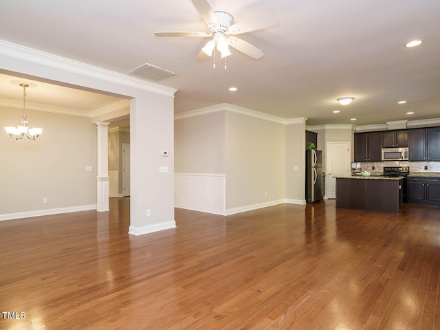unfurnished living room with a ceiling fan, dark wood-style floors, a chandelier, ornate columns, and recessed lighting