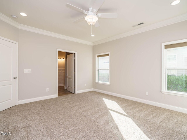 unfurnished bedroom with carpet, baseboards, multiple windows, ornamental molding, and recessed lighting