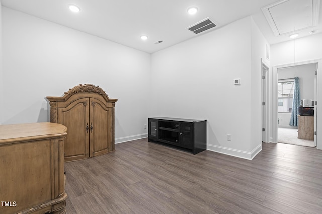 interior space featuring attic access, visible vents, recessed lighting, dark wood-style flooring, and baseboards