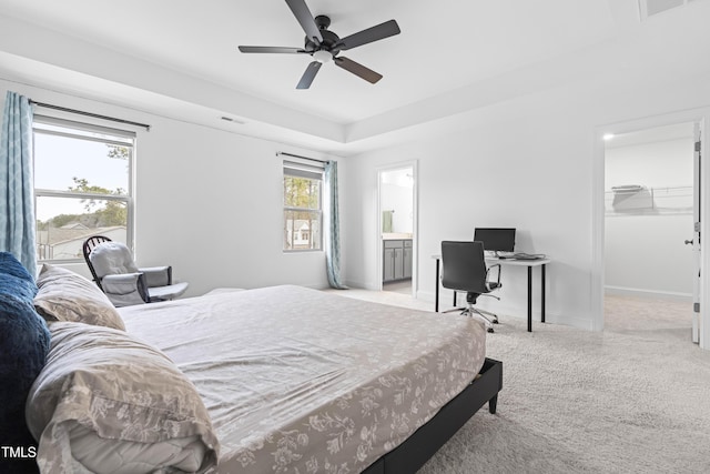 bedroom featuring carpet, visible vents, a spacious closet, a ceiling fan, and baseboards