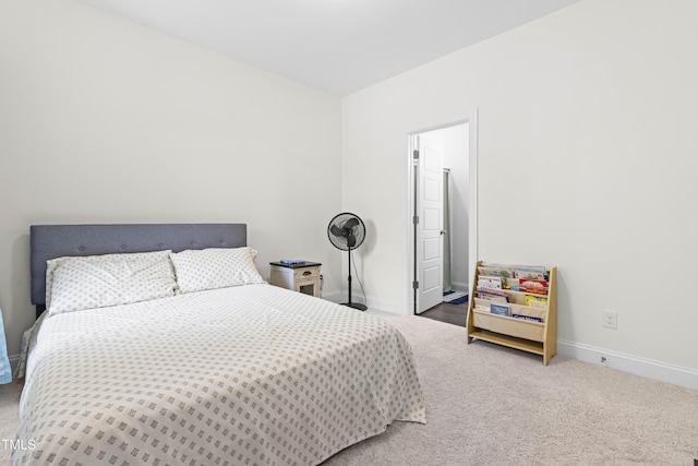 bedroom with carpet flooring and baseboards