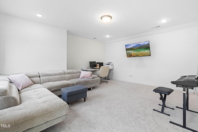 carpeted living area featuring baseboards, visible vents, and recessed lighting