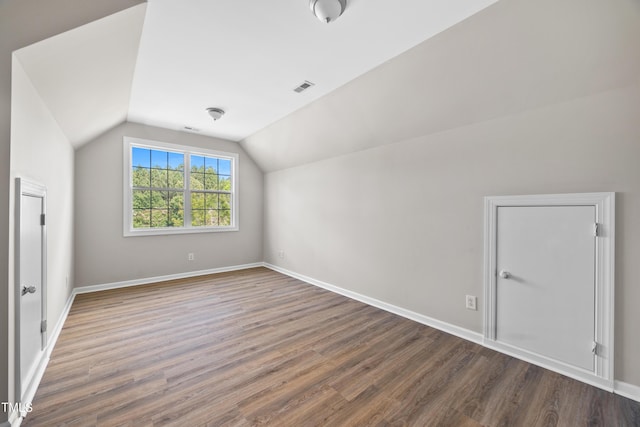 120 Hatchet Creek Ct, Morrisville, NC 27560 - bonus room with wood finished floors, vaulted ceiling, and baseboards
