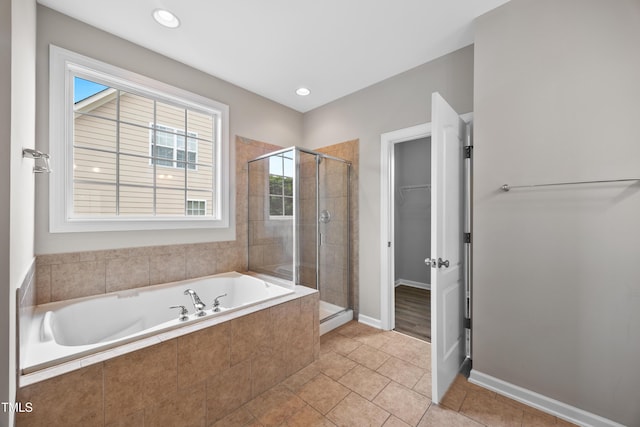 120 Hatchet Creek Ct, Morrisville, NC 27560 - bathroom featuring a shower stall, a bath, a spacious closet, and healthy amount of natural light