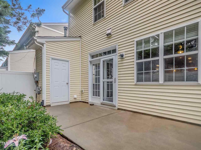 8016 Sycamore Hill Ln, Raleigh, NC 27612 - view of exterior entry with fence and a patio