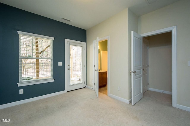8016 Sycamore Hill Ln, Raleigh, NC 27612 - unfurnished bedroom featuring access to exterior, light carpet, baseboards, and visible vents