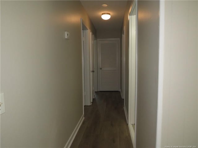 6324 Brussels Ct, Fayetteville, NC 28304 - corridor featuring baseboards and dark wood-style floors