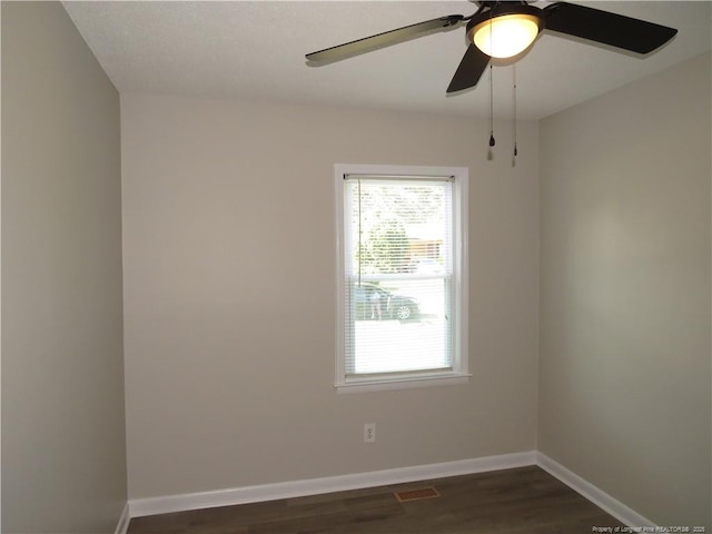 6324 Brussels Ct, Fayetteville, NC 28304 - unfurnished room featuring visible vents, baseboards, ceiling fan, and dark wood-style floors