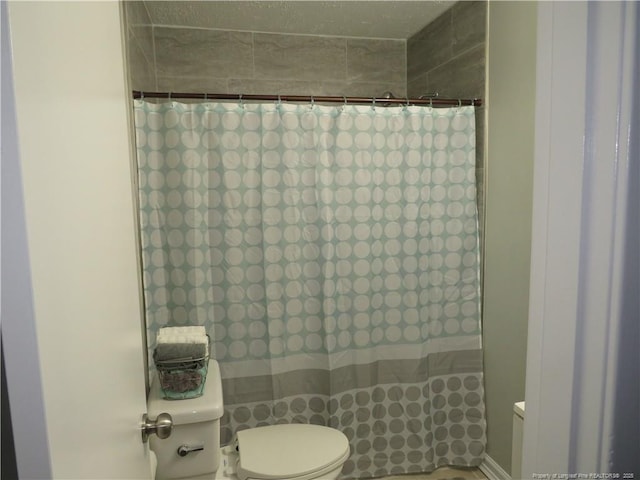6324 Brussels Ct, Fayetteville, NC 28304 - bathroom featuring toilet and a shower with shower curtain
