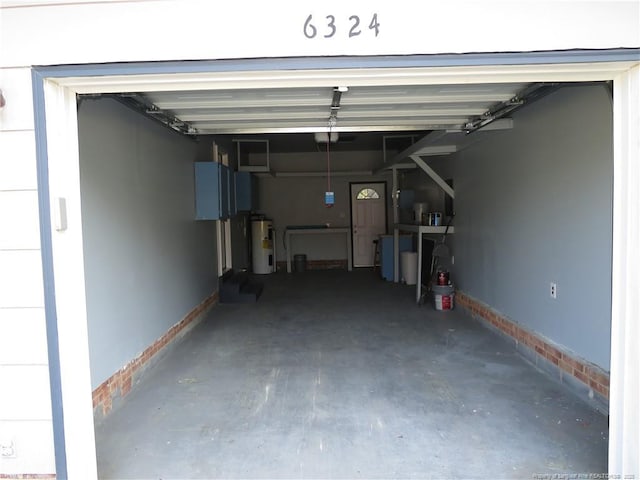 6324 Brussels Ct, Fayetteville, NC 28304 - garage featuring electric water heater, baseboards, and a garage door opener