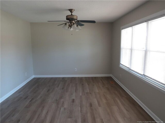 6324 Brussels Ct, Fayetteville, NC 28304 - unfurnished room with baseboards, wood finished floors, and a ceiling fan
