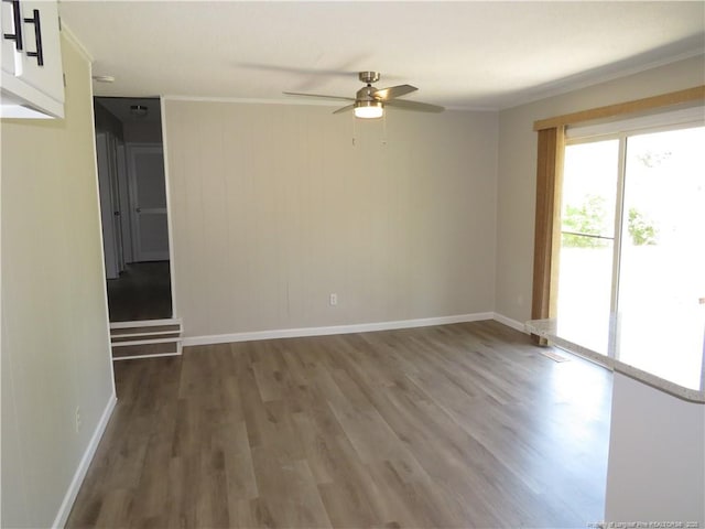 6324 Brussels Ct, Fayetteville, NC 28304 - spare room with baseboards, crown molding, ceiling fan, and wood finished floors