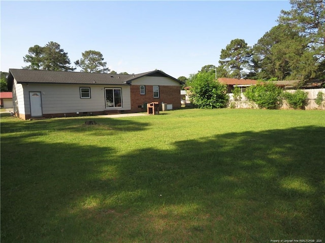 6324 Brussels Ct, Fayetteville, NC 28304 - back of house featuring a yard