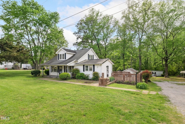 183 Red Hill Loop Rd, Warrenton, NC 27589 - cape cod-style house featuring a porch and a front yard