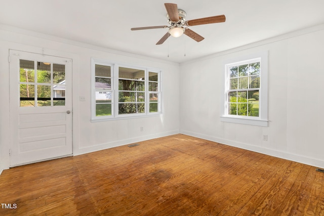 183 Red Hill Loop Rd, Warrenton, NC 27589 - spare room with baseboards, ceiling fan, visible vents, and wood finished floors