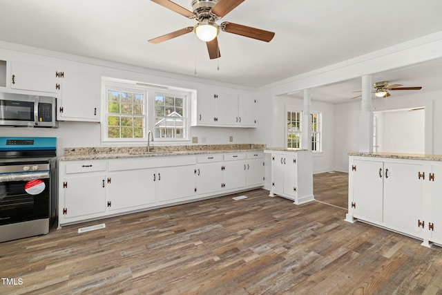 183 Red Hill Loop Rd, Warrenton, NC 27589 - kitchen featuring stainless steel appliances, wood finished floors, ceiling fan, and a sink