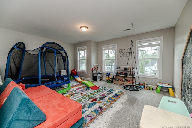 game room with carpet, baseboards, and visible vents