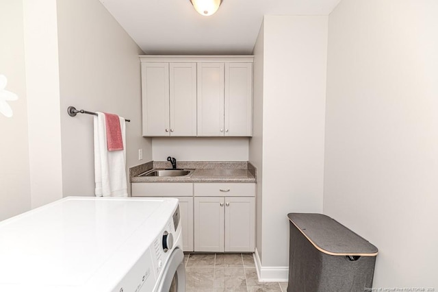 laundry area with a sink, cabinet space, marble finish floor, separate washer and dryer, and baseboards