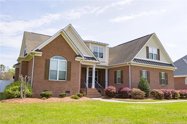 view of front of house with a standing seam roof, brick siding, crawl space, roof with shingles, and a front lawn