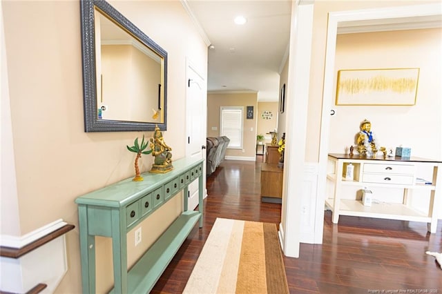 hallway with ornamental molding, recessed lighting, and dark wood-type flooring
