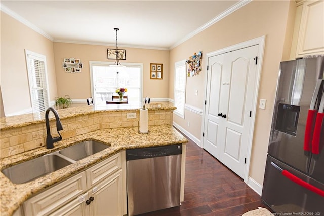 kitchen with decorative light fixtures, ornamental molding, a sink, stainless steel appliances, and dark wood-style floors