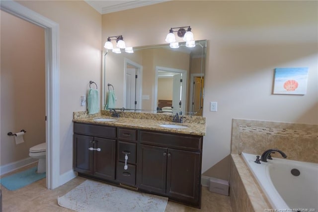 bathroom with double vanity, a garden tub, toilet, and a sink