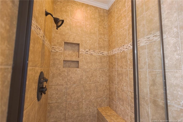 details featuring crown molding and a tile shower