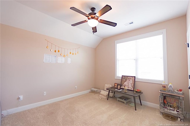 interior space featuring a ceiling fan, baseboards, visible vents, and carpet floors