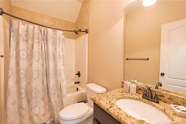 bathroom featuring toilet, shower / tub combo, and vanity