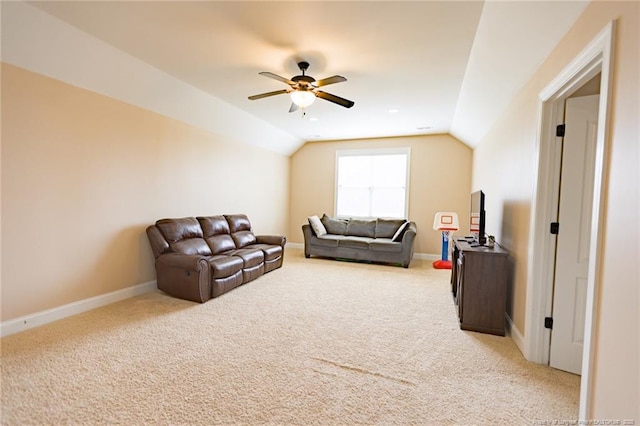 living room with baseboards, light carpet, a ceiling fan, and vaulted ceiling