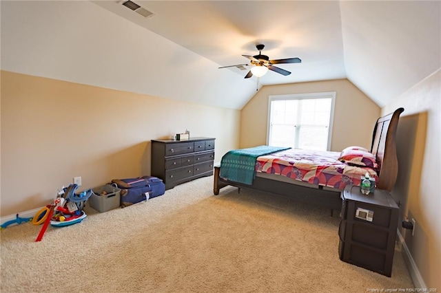 carpeted bedroom featuring ceiling fan, visible vents, and vaulted ceiling