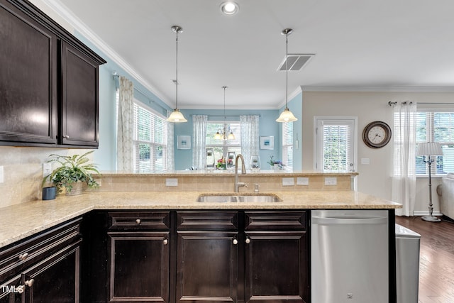 kitchen featuring stainless steel dishwasher, a sink, crown molding, dark brown cabinetry, and a peninsula