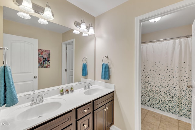 full bath featuring double vanity, baseboards, tile patterned floors, and curtained shower