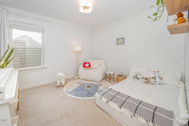 carpeted bedroom featuring ornamental molding and baseboards