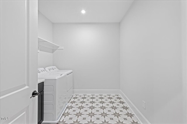 clothes washing area with washing machine and dryer, light floors, baseboards, and recessed lighting