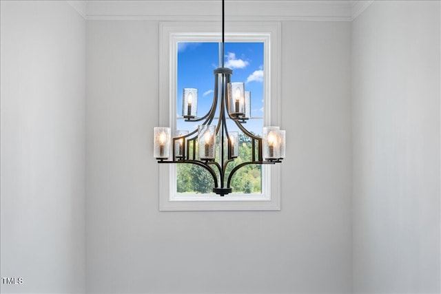 detailed view of a chandelier and ornamental molding