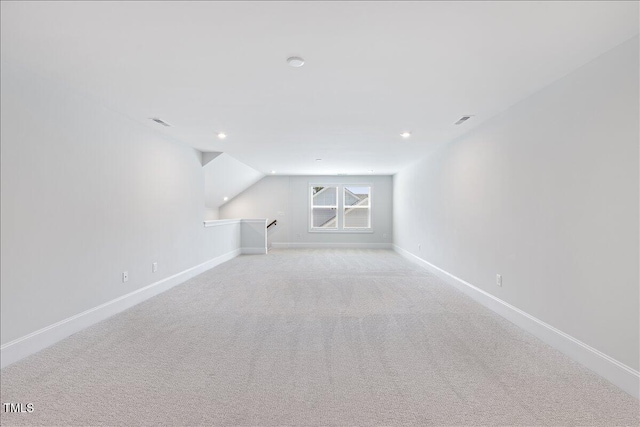 bonus room with light colored carpet, baseboards, recessed lighting, and lofted ceiling