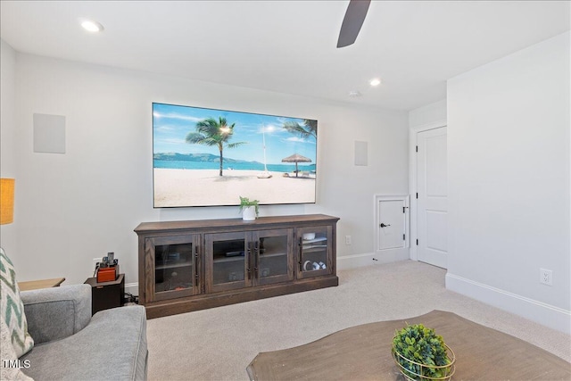 living area with a ceiling fan, carpet, baseboards, and recessed lighting