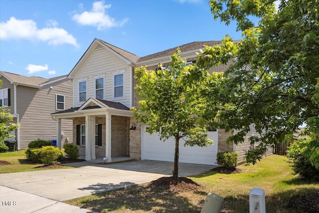 833 Ember Dr, Durham, NC 27703 - view of front of property featuring concrete driveway, a garage, brick siding, and a front yard