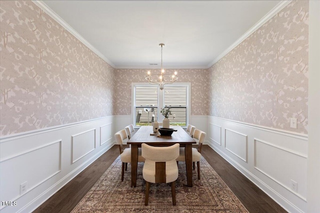 833 Ember Dr, Durham, NC 27703 - dining area with dark wood-style floors, wallpapered walls, a chandelier, a wainscoted wall, and crown molding