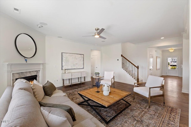 833 Ember Dr, Durham, NC 27703 - living room featuring wood finished floors, a ceiling fan, stairs, baseboards, and ornamental molding