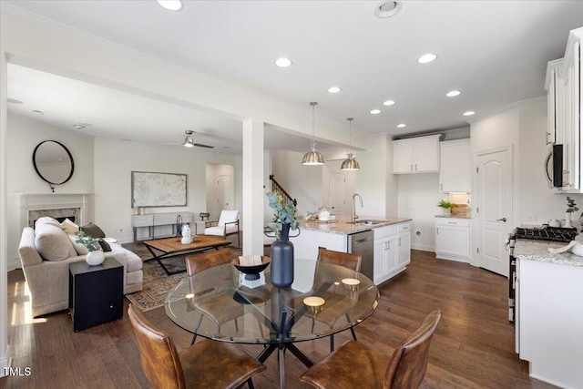 833 Ember Dr, Durham, NC 27703 - dining space featuring dark wood-style flooring, recessed lighting, crown molding, a ceiling fan, and a high end fireplace