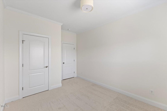 833 Ember Dr, Durham, NC 27703 - unfurnished bedroom with carpet floors, ornamental molding, and baseboards