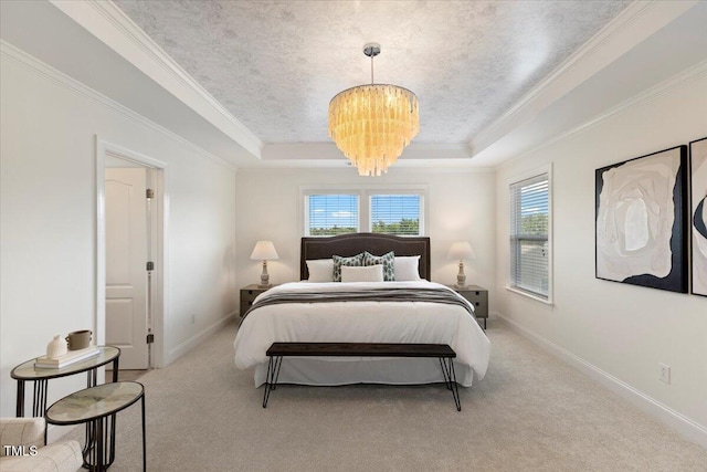833 Ember Dr, Durham, NC 27703 - bedroom featuring a tray ceiling, multiple windows, carpet floors, crown molding, and a chandelier