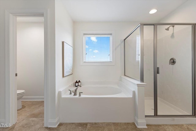 833 Ember Dr, Durham, NC 27703 - bathroom with a bath, a shower stall, and toilet