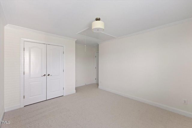 833 Ember Dr, Durham, NC 27703 - unfurnished bedroom with attic access, ornamental molding, carpet, baseboards, and a closet