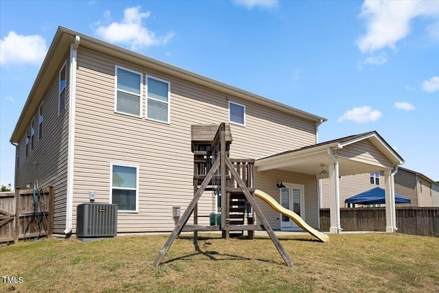 833 Ember Dr, Durham, NC 27703 - back of house with a playground and central air condition unit