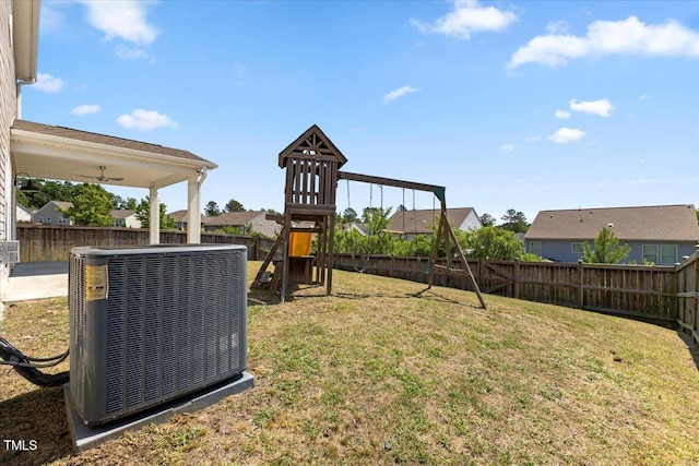 833 Ember Dr, Durham, NC 27703 - view of yard featuring central AC unit, a playground, and a residential view