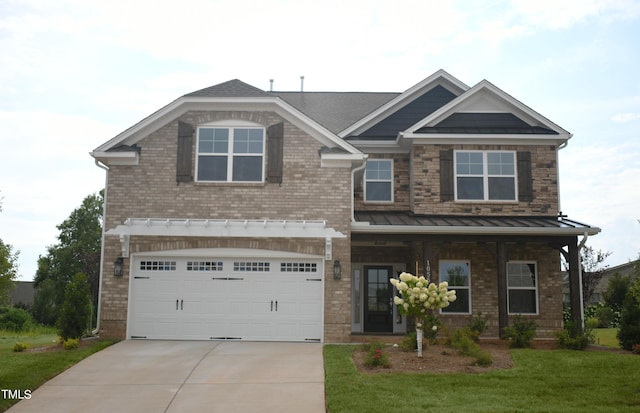 1055 Tulloch Ct Unit 202, Burlington, NC 27215 - craftsman house featuring driveway, brick siding, an attached garage, and a front yard