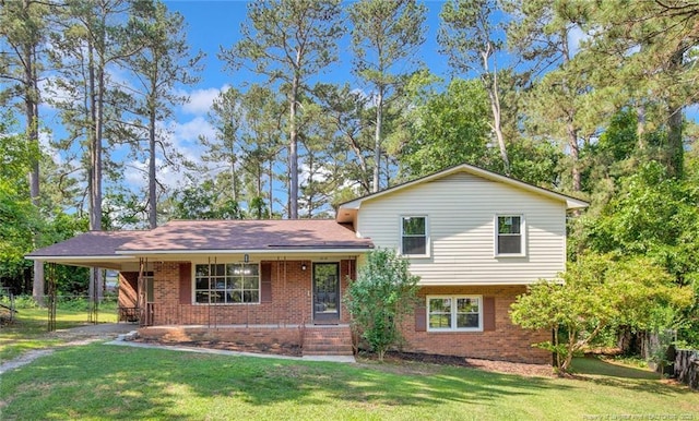 1618 Hickory Ridge Ct, Fayetteville, NC 28304 - split level home with brick siding, an attached carport, covered porch, and driveway